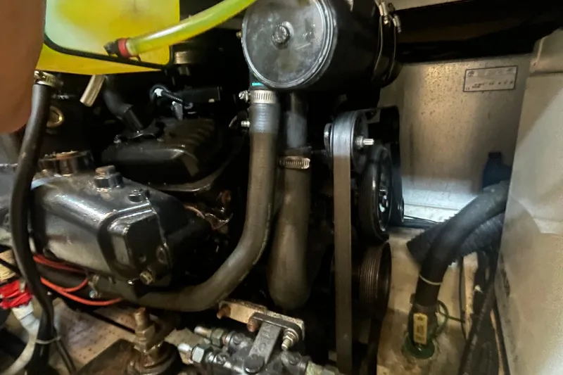  Yacht Photos Pics Engine compartment of a 2002 Carver 346 Aft Cabin boat, showing hoses and components.