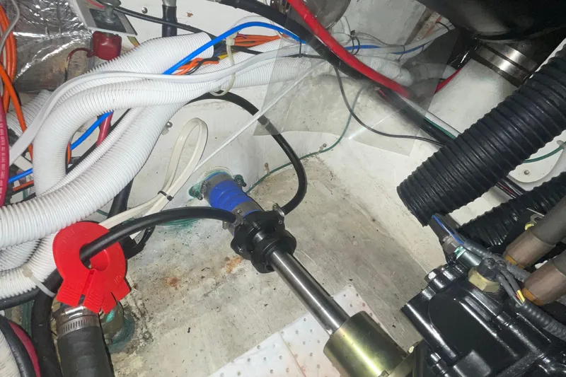  Yacht Photos Pics Engine compartment of a 2002 Carver 346 Aft Cabin with visible wiring and hoses.