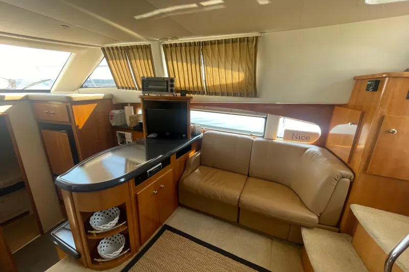  Yacht Photos Pics Interior of 2002 Carver 346 Aft Cabin yacht with cozy seating and modern amenities.