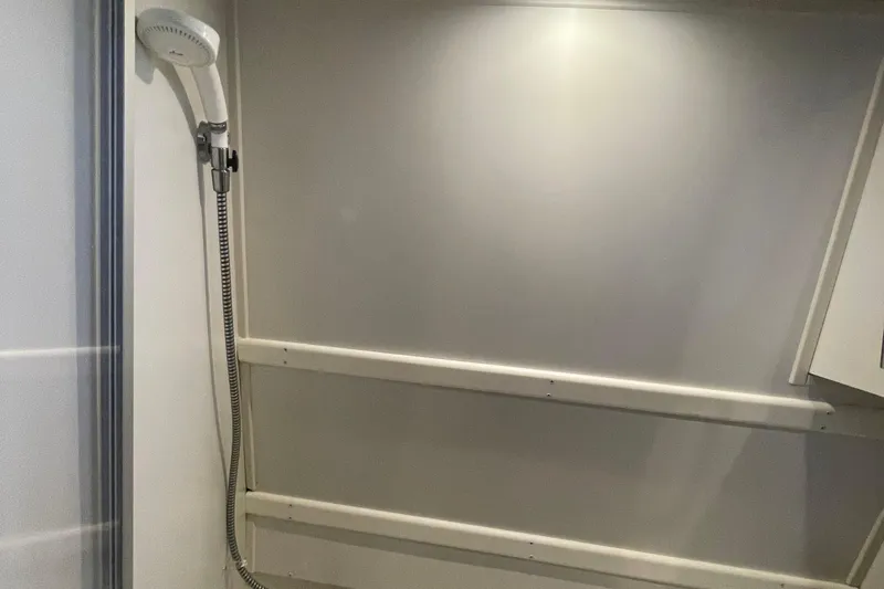  Yacht Photos Pics Shower area in 2002 Carver 346 Aft Cabin yacht, featuring a handheld showerhead.