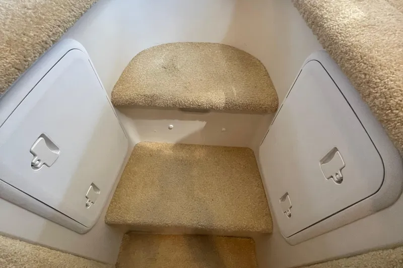  Yacht Photos Pics Carpeted stairs inside 2002 Carver 346 Aft Cabin yacht with storage compartments.