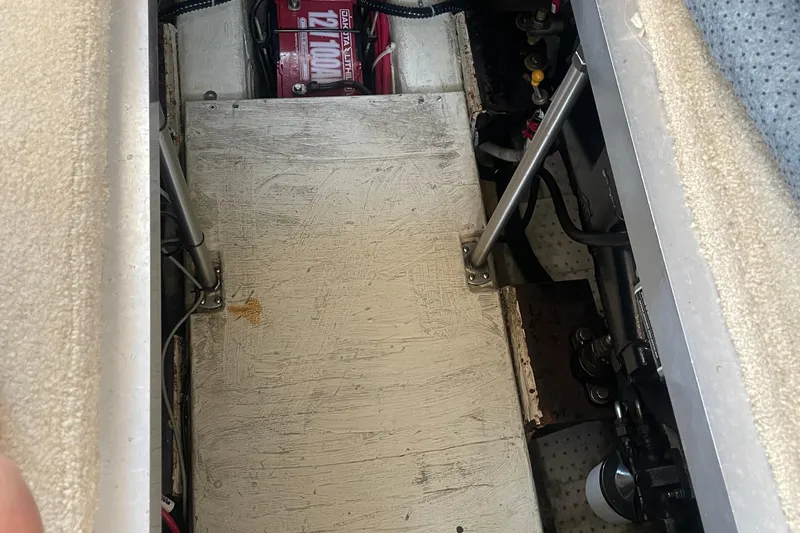  Yacht Photos Pics Engine compartment of a 2002 Carver 346 Aft Cabin boat, showing battery and mechanical components.