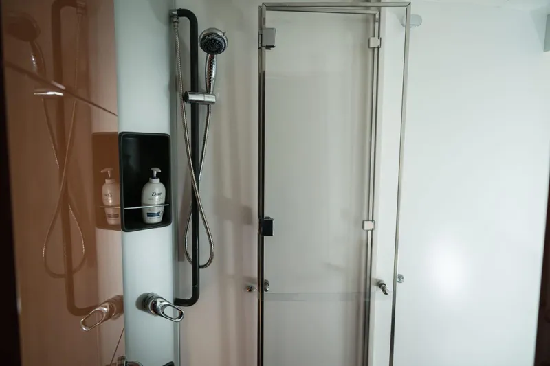  Yacht Photos Pics Modern shower area in a 2006 Pershing 62' yacht bathroom.