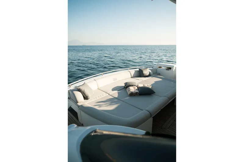  Yacht Photos Pics Luxurious 2006 Pershing 62' yacht with spacious sun deck overlooking serene ocean.