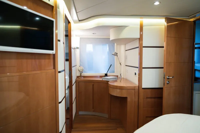  Yacht Photos Pics Luxurious interior of a 2006 Pershing 62' yacht with modern wood finishes.
