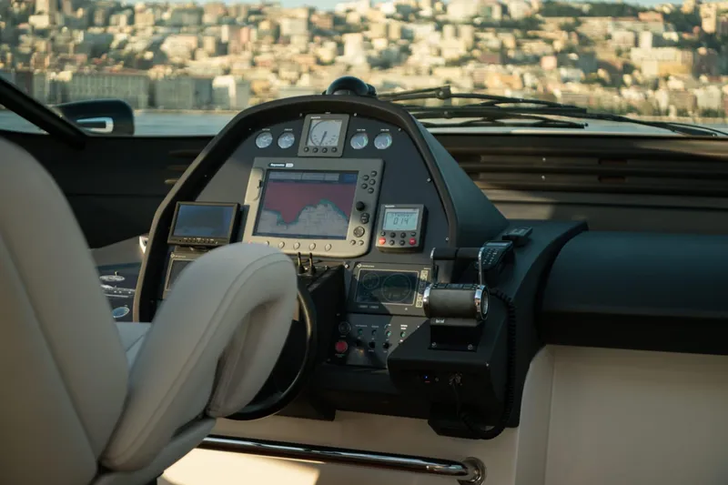  Yacht Photos Pics Cockpit of 2006 Pershing 62' yacht with navigation equipment and cityscape view.