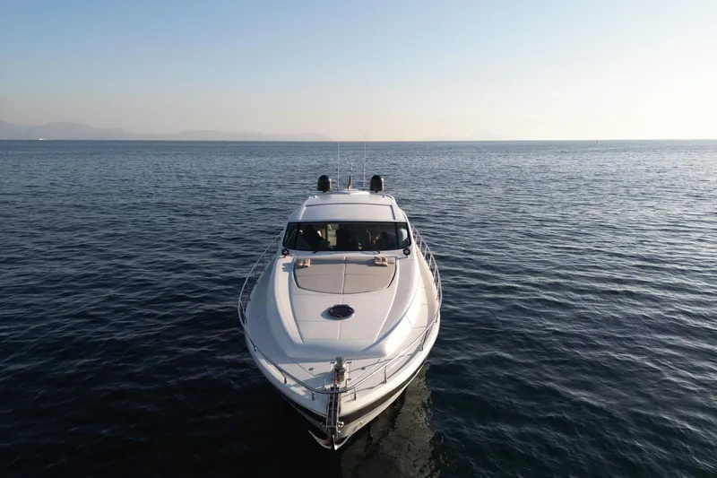  Yacht Photos Pics 2006 Pershing 62' yacht on calm sea under clear sky.