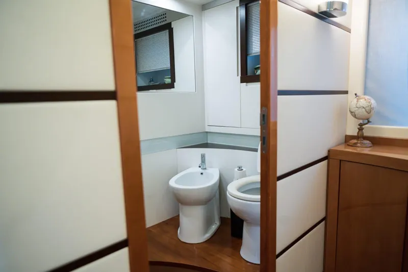  Yacht Photos Pics Luxurious bathroom interior on a 2006 Pershing 62' yacht, featuring modern fixtures.