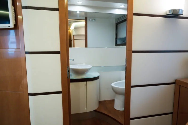  Yacht Photos Pics Luxurious bathroom interior on a 2006 Pershing 62' yacht, featuring modern fixtures.