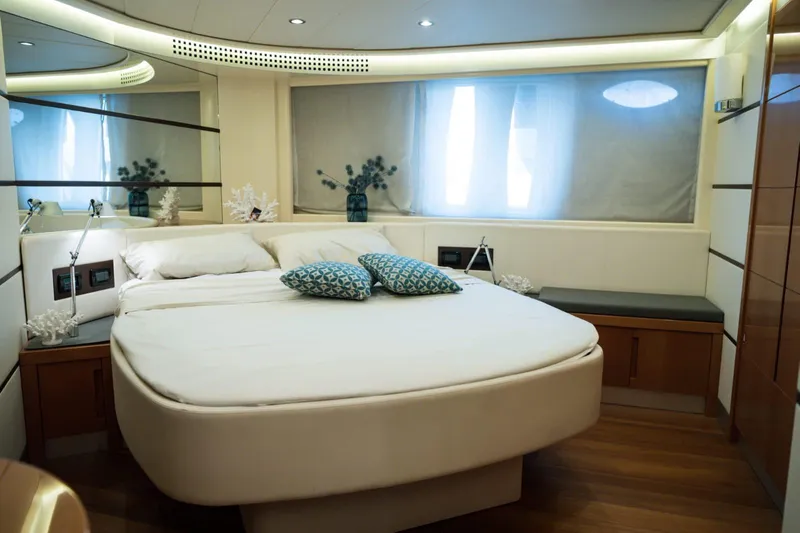  Yacht Photos Pics Luxurious bedroom interior of a 2006 Pershing 62' yacht with modern decor.