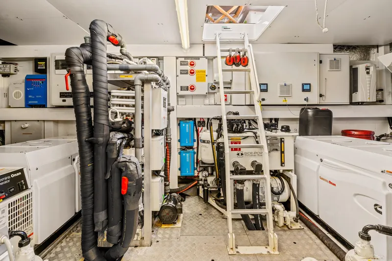  Yacht Photos Pics Engine room of a 2014 Sunseeker 75 Yacht with advanced machinery and equipment.