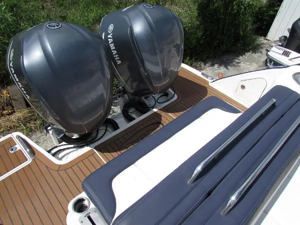 317-147 Ray Brokerage Yacht Photos Pics 2018 Robalo R317 Dual Console with twin Yamaha outboard engines on teak deck.