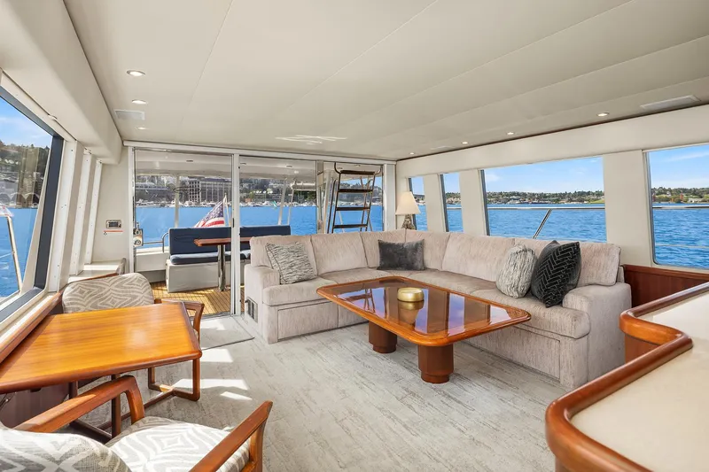 Escencia Yacht Photos Pics Luxurious interior of a 2003 Pacific Mariner Pilothouse yacht with elegant seating and ocean views.