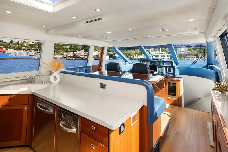 Escencia Yacht Photos Pics Luxurious 2003 Pacific Mariner Pilothouse interior with modern kitchen and scenic ocean views.