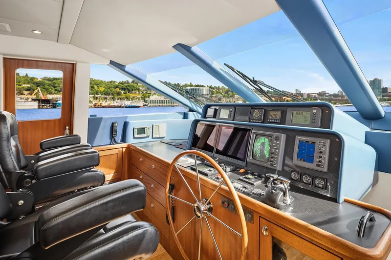 Escencia Yacht Photos Pics 2003 Pacific Mariner Pilothouse interior with navigation controls and leather seating.