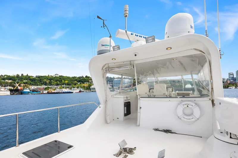 Escencia Yacht Photos Pics 2003 Pacific Mariner Pilothouse yacht on water, featuring sleek design and modern amenities.