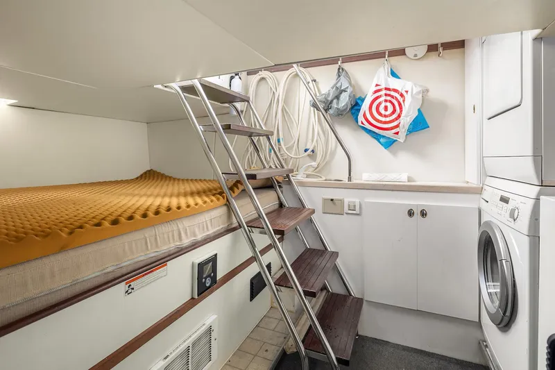 Escencia Yacht Photos Pics 2003 Pacific Mariner Pilothouse interior with bed, ladder, and laundry area.