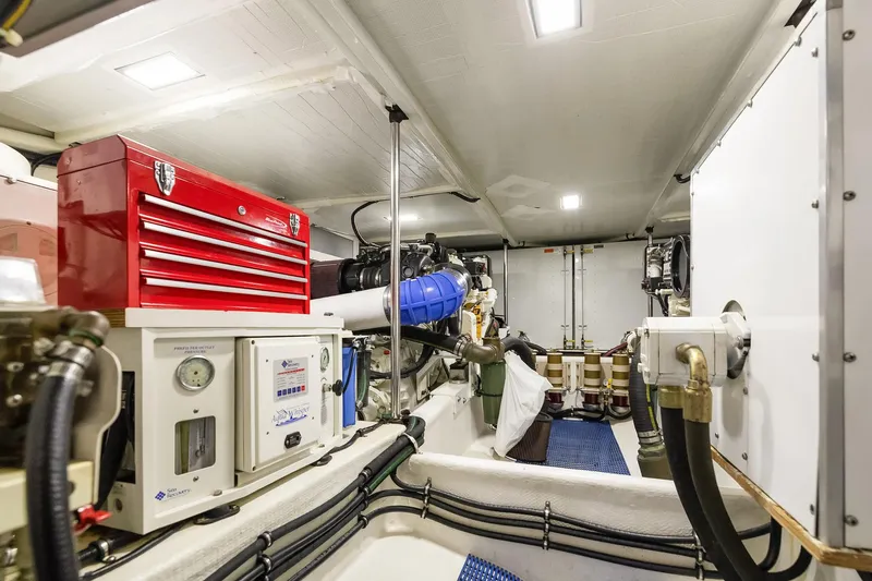 Escencia Yacht Photos Pics Engine room of 2003 Pacific Mariner Pilothouse with tools and equipment.