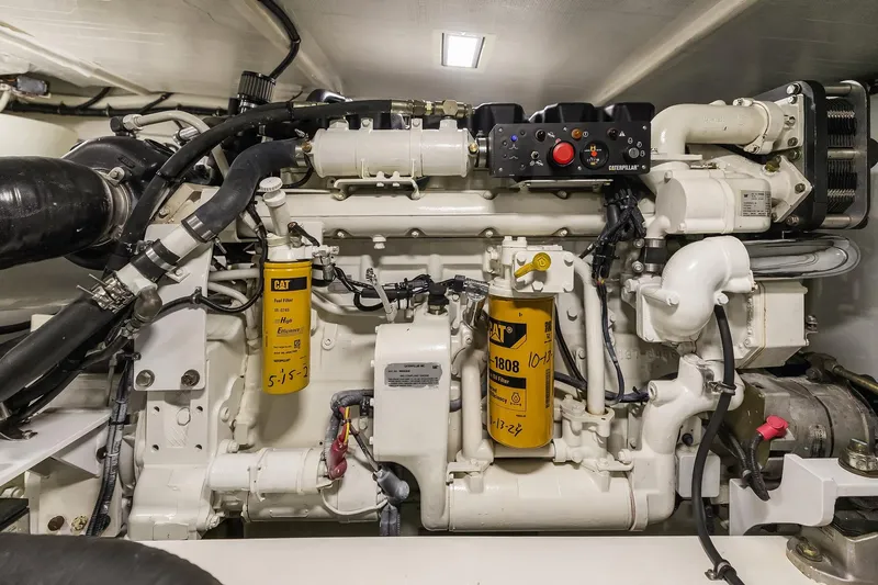 Escencia Yacht Photos Pics Engine room of 2003 Pacific Mariner Pilothouse yacht, featuring detailed machinery and components.