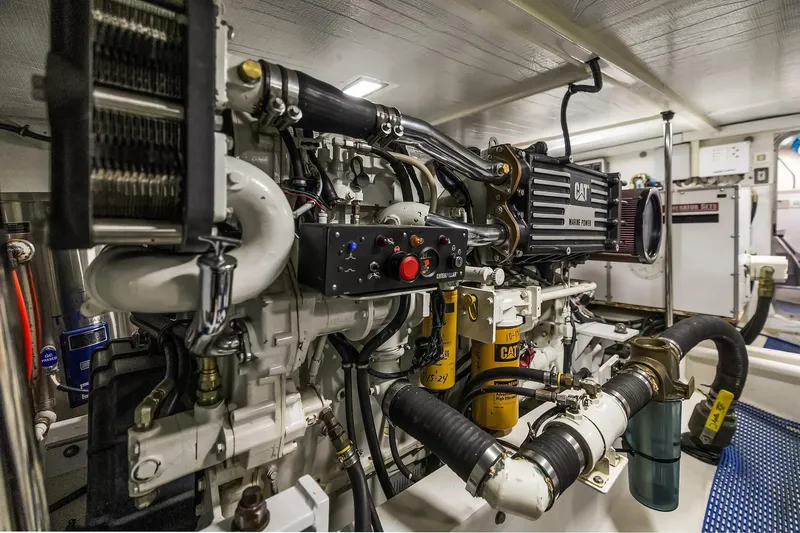 Escencia Yacht Photos Pics Engine room of 2003 Pacific Mariner Pilothouse yacht, featuring CAT machinery and components.