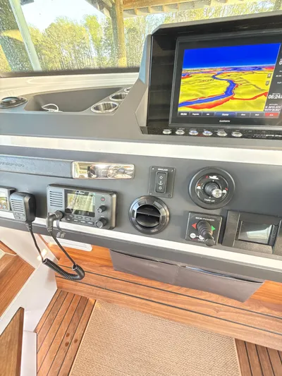  Yacht Photos Pics 2019 Axopar 28 CABIN dashboard with navigation screen and control panel.