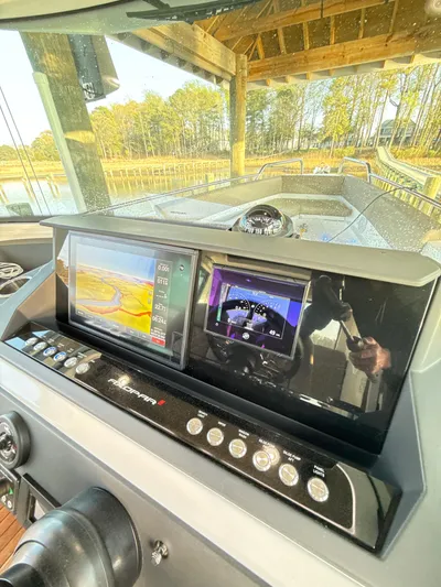  Yacht Photos Pics Control panel of 2019 Axopar 28 CABIN boat with navigation screens.