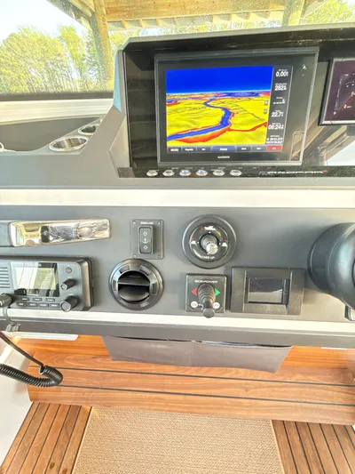  Yacht Photos Pics Control panel of 2019 Axopar 28 CABIN with navigation display and instruments.