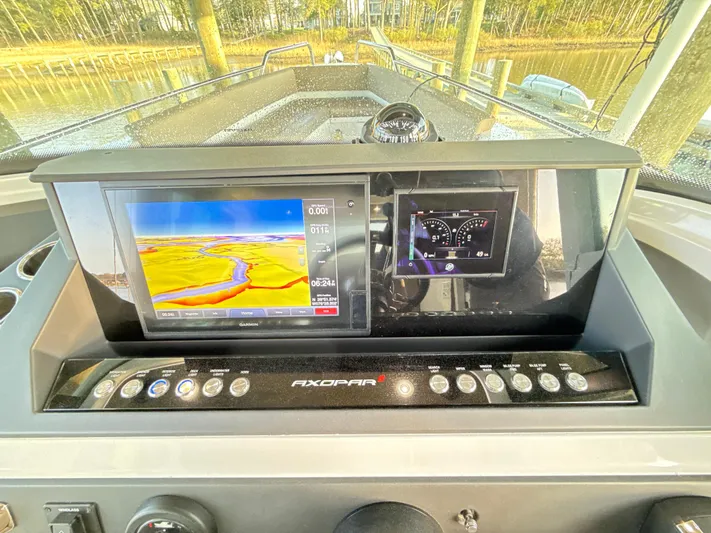 Yacht Photos Pics Dashboard of 2019 Axopar 28 CABIN with navigation and control screens.