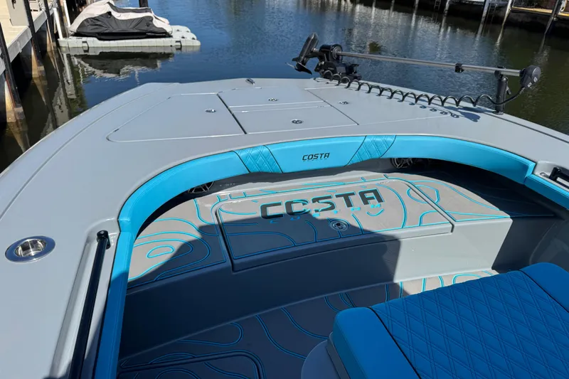  Yacht Photos Pics 2026 Costa Custom Boats 264 HC, sleek design, blue accents, docked on calm water.