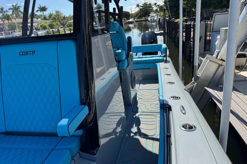  Yacht Photos Pics 2026 Costa Custom Boats 264 HC interior with blue seating and sleek design.