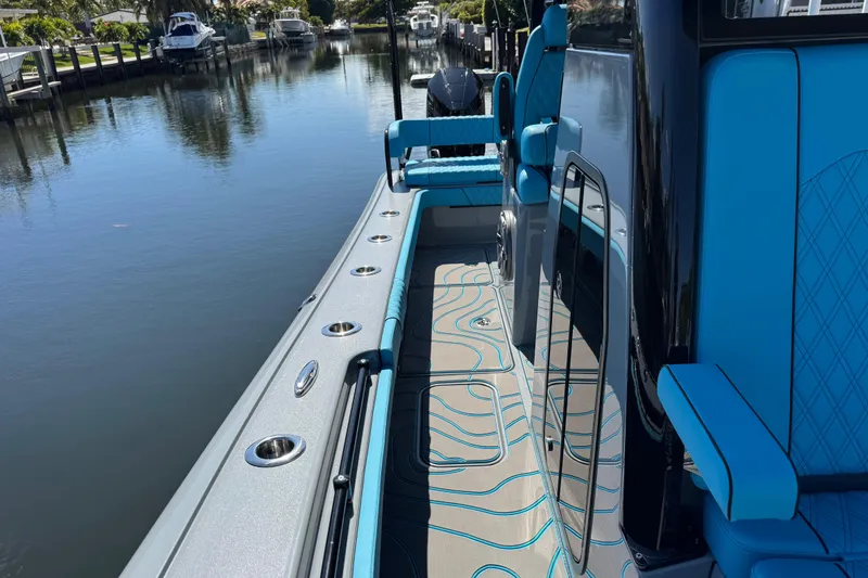  Yacht Photos Pics 2026 Costa Custom Boats 264 HC, sleek design, blue interior, docked on calm water.