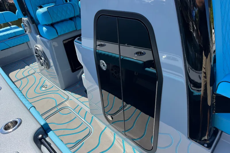  Yacht Photos Pics 2026 Costa Custom Boats 264 HC interior with blue seating and sleek design.