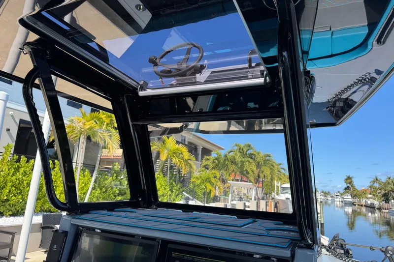  Yacht Photos Pics 2026 Costa Custom Boats 264 HC interior with modern design, overlooking a scenic waterfront.