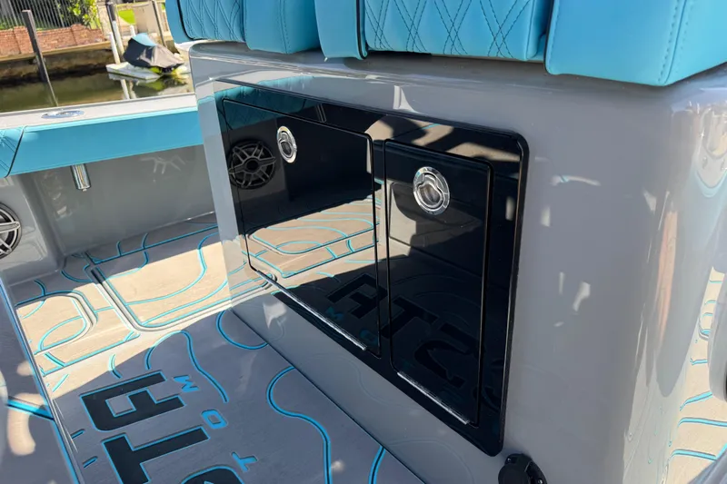  Yacht Photos Pics 2026 Costa Custom Boats 264 HC interior with blue seating and sleek storage compartments.