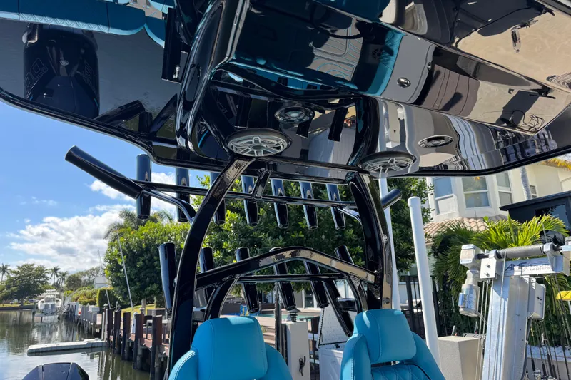  Yacht Photos Pics 2026 Costa Custom Boats 264 HC with sleek black canopy and blue seating.