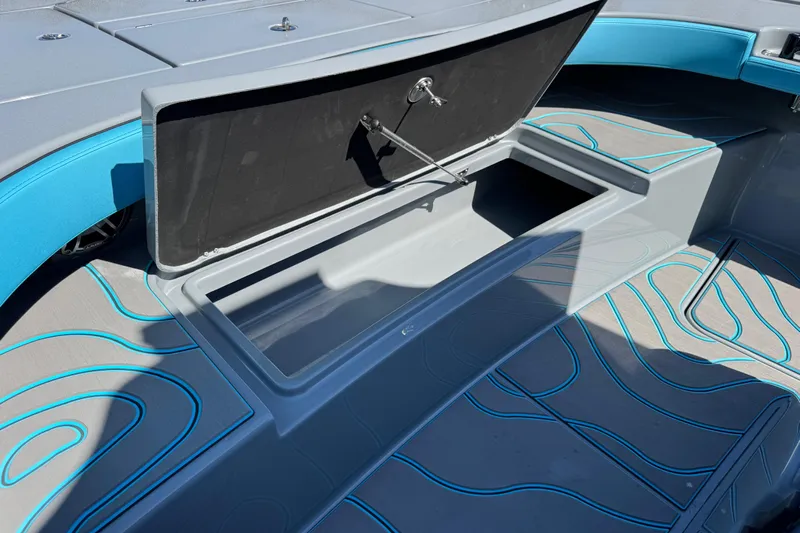  Yacht Photos Pics Open storage compartment on 2026 Costa Custom Boats 264 HC with stylish blue accents.