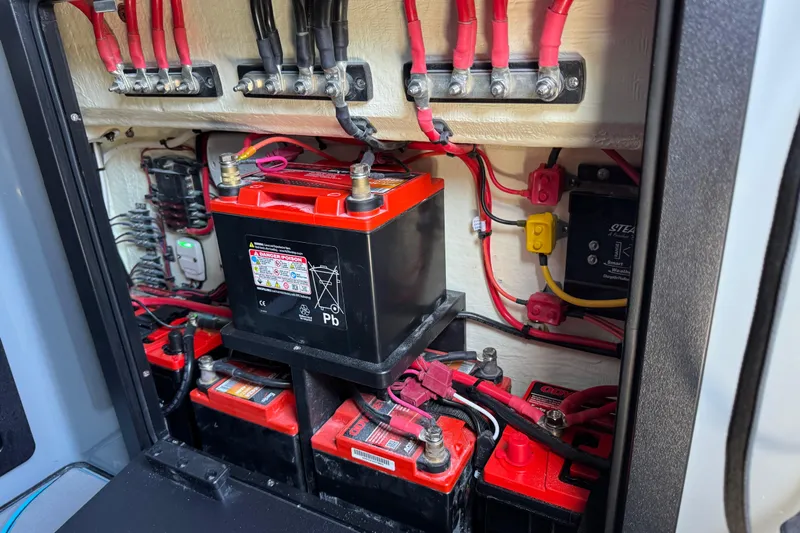  Yacht Photos Pics Battery compartment of 2026 Costa Custom Boats 264 HC, featuring multiple red and black cables.
