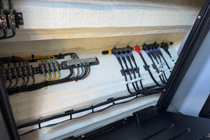  Yacht Photos Pics Electrical wiring inside 2026 Costa Custom Boats 264 HC, showcasing organized cable management.