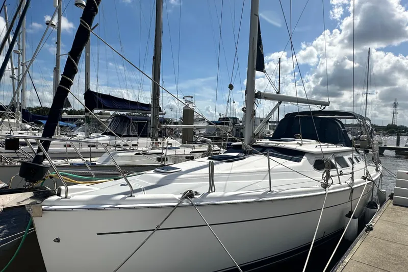 Ms Bea Haven Yacht Photos Pics 2006 Hunter 41 Deck Salon sailboat docked at marina under blue sky.