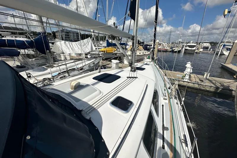 Ms Bea Haven Yacht Photos Pics 2006 Hunter 41 Deck Salon sailboat docked at marina under blue sky.