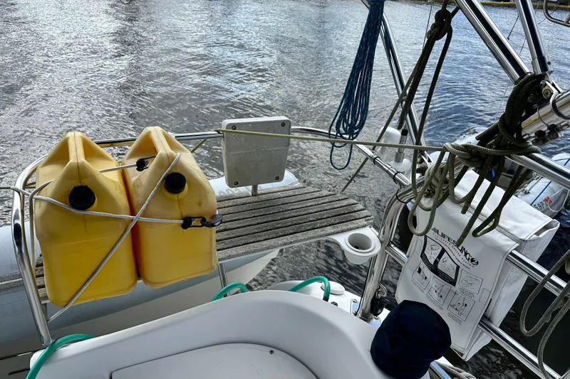 Ms Bea Haven Yacht Photos Pics Hunter 41 Deck Salon 2006 sailboat deck with yellow fuel containers and ropes.