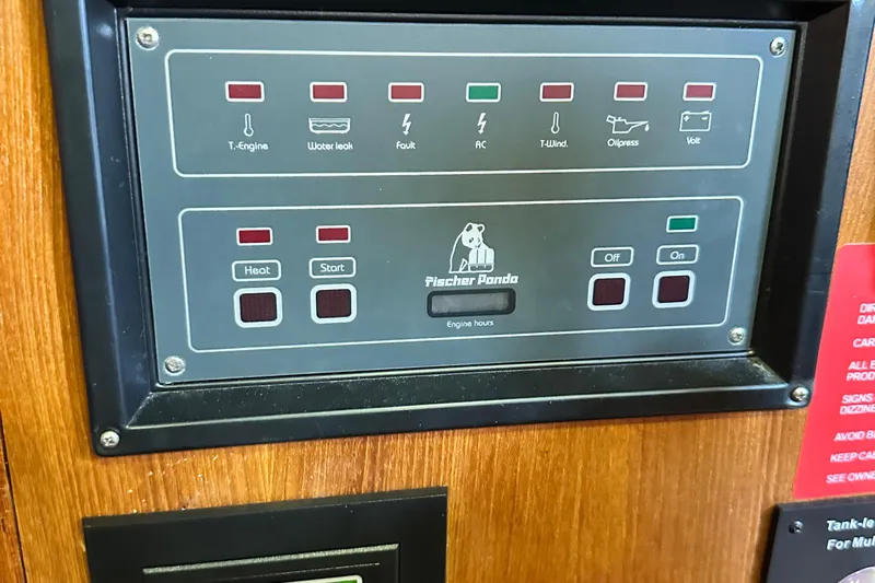 Ms Bea Haven Yacht Photos Pics Control panel of a 2006 Hunter 41 Deck Salon boat with Fischer Panda display.