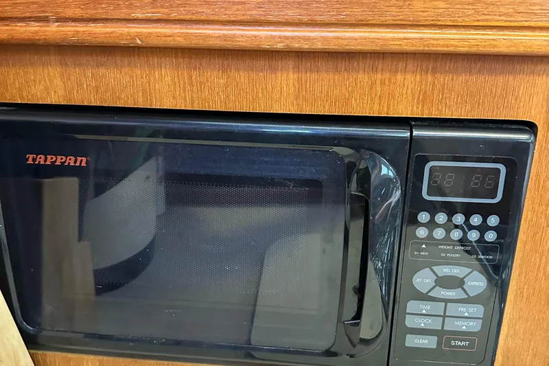 Ms Bea Haven Yacht Photos Pics Tappan microwave in 2006 Hunter 41 Deck Salon yacht kitchen.