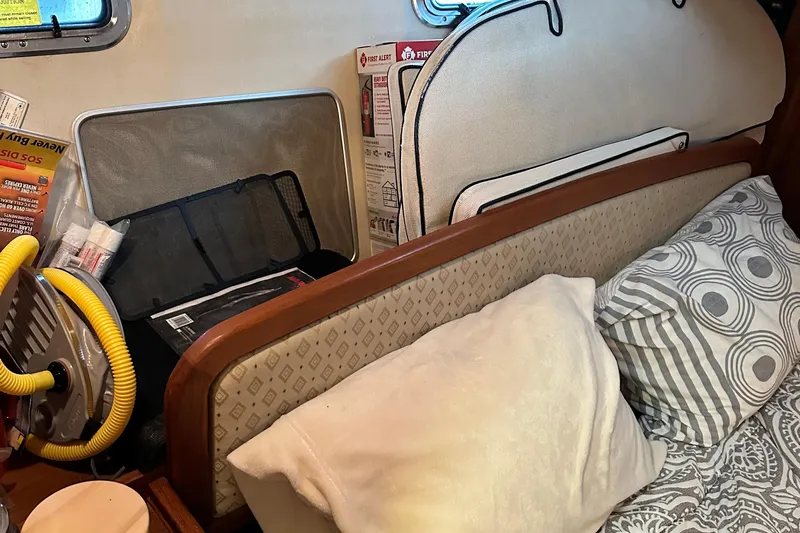 Ms Bea Haven Yacht Photos Pics Interior of 2006 Hunter 41 Deck Salon with cushions, pillows, and safety equipment.