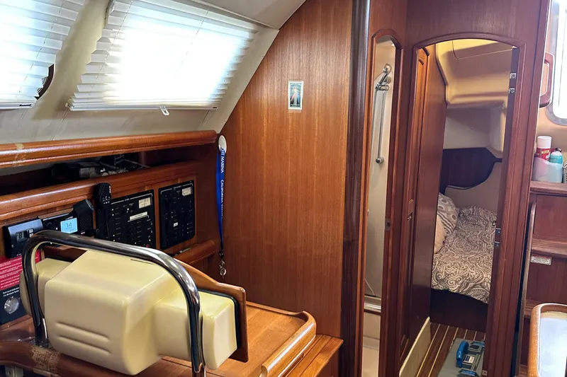 Ms Bea Haven Yacht Photos Pics Interior of 2006 Hunter 41 Deck Salon yacht with wood paneling and cozy cabin.