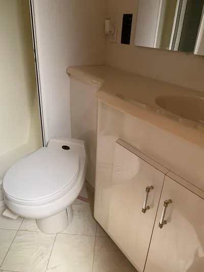 Pier Pressure Yacht Photos Pics Bathroom interior of a 2000 Viking 50 Convertible yacht with toilet and vanity.
