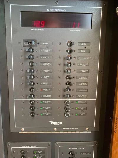 Pier Pressure Yacht Photos Pics Electrical panel of a 2000 Viking 50 Convertible boat, showing battery voltage and current.
