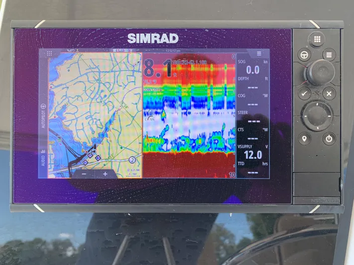 Pier Pressure Yacht Photos Pics Simrad navigation and sonar display on 2000 Viking 50 Convertible boat.
