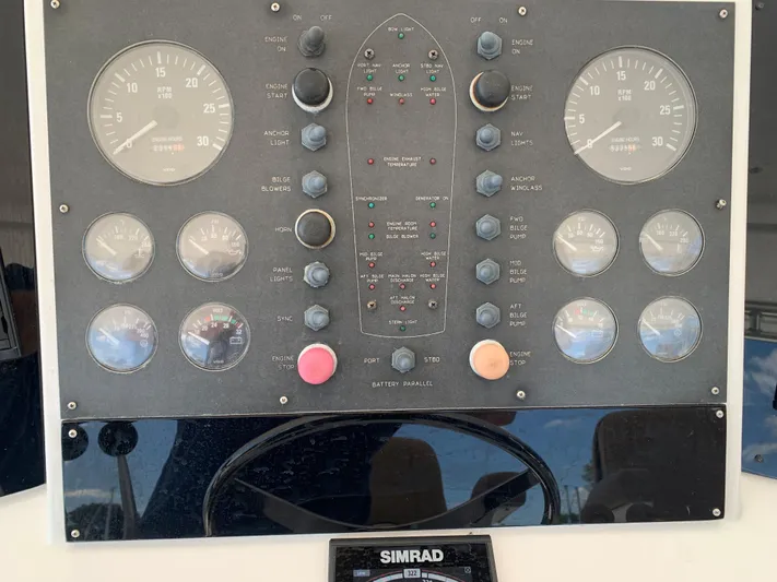 Pier Pressure Yacht Photos Pics Control panel of a 2000 Viking 50 Convertible boat with Simrad navigation system.