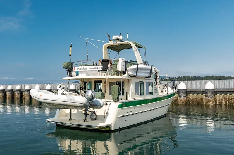 Greymalkin II Yacht Photos Pics 2008 North Pacific 39 Pilothouse yacht docked with inflatable boat attached.